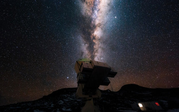 An observatory at night against a background of the Milky Way.